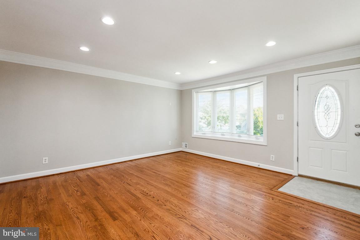 14016 Adkins Road Laurel, MD 20708 - Photo 5 of 54 A large bow window and beautiful hardwoods