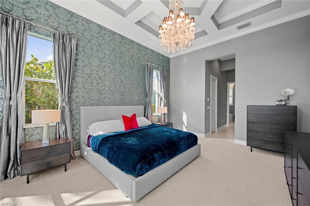 14792 Spinnaker Way Naples, FL 34114 - Photo 17 of 48 a bedroom with a bed and a dresser