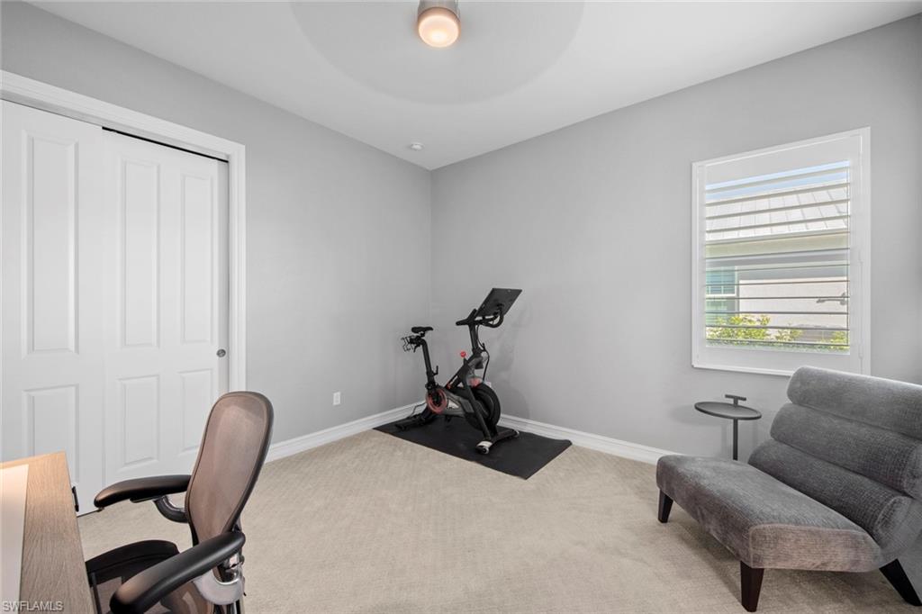 14792 Spinnaker Way Naples, FL 34114 - Photo 25 of 48 a work room with furniture and windows
