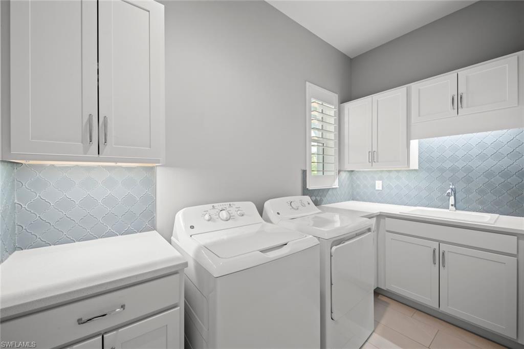 14792 Spinnaker Way Naples, FL 34114 - Photo 28 of 48 a utility room with dryer and washer