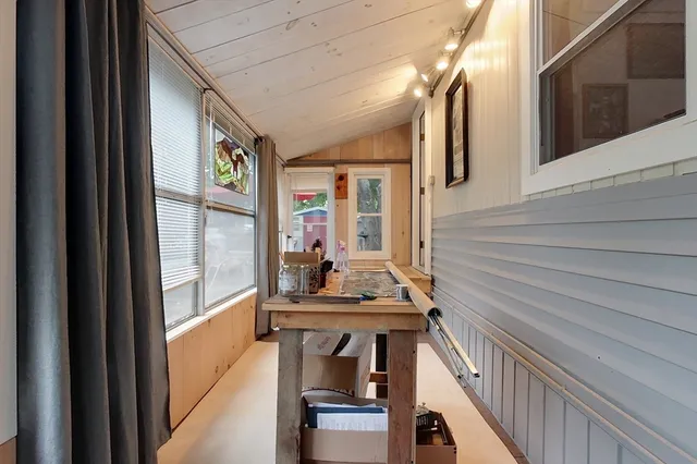 a view of living room kitchen and entryway