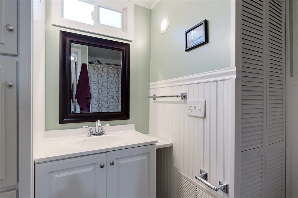 239 Ayer Road, Unit 16 Littleton, MA 01460 - Photo 14 of 22 a bathroom with a sink and a mirror