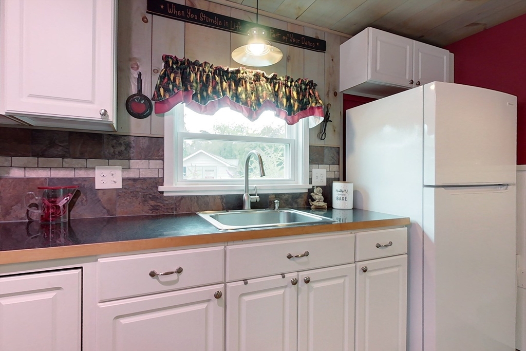 239 Ayer Road, Unit 16 Littleton, MA 01460 - Photo 3 of 22 a kitchen with appliances cabinets and a counter top space
