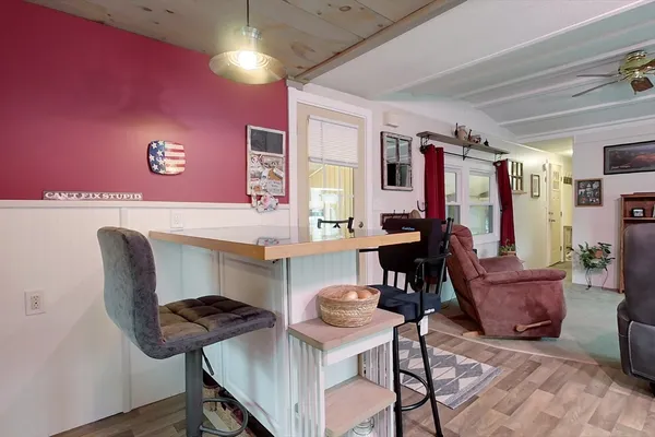a view of a livingroom with furniture and a piano