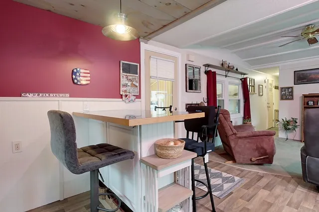a view of a livingroom with furniture and a piano