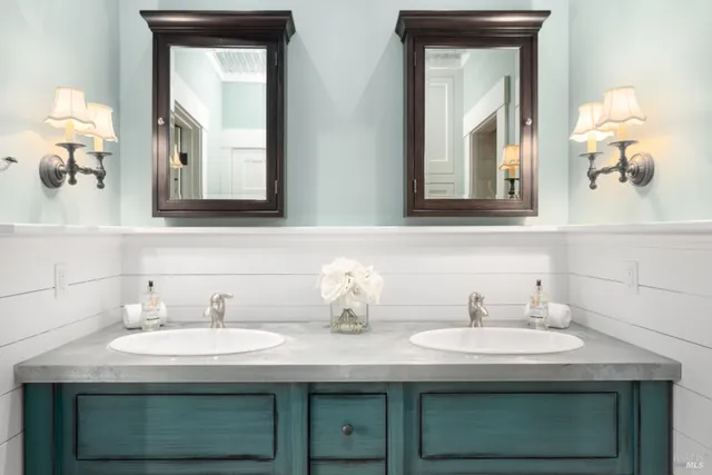a bathroom with sink and mirror