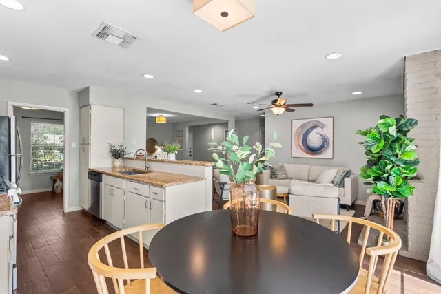 a kitchen with a table and chairs