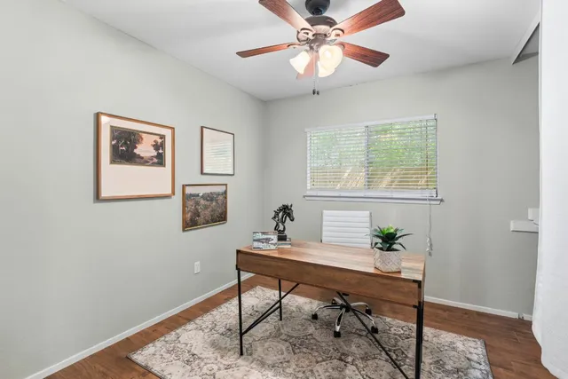 a workspace with furniture and window