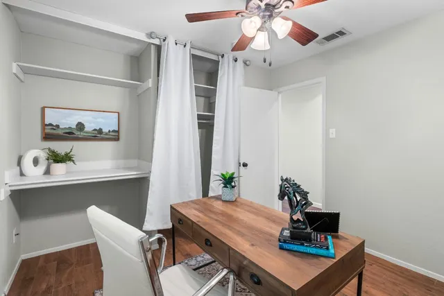 a view of a workspace with furniture