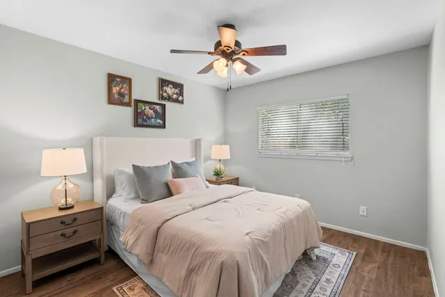a bedroom with bed and window