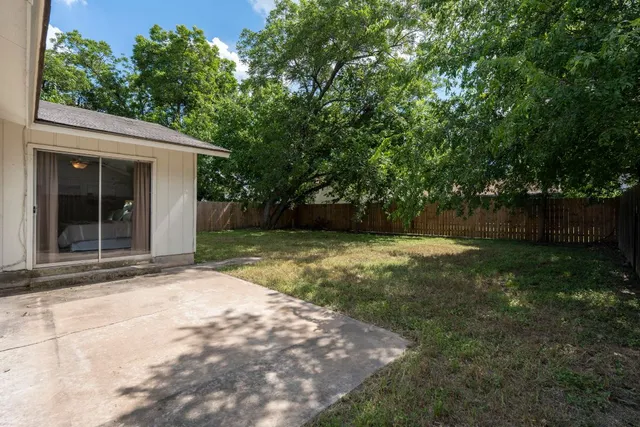 a view of backyard with green space