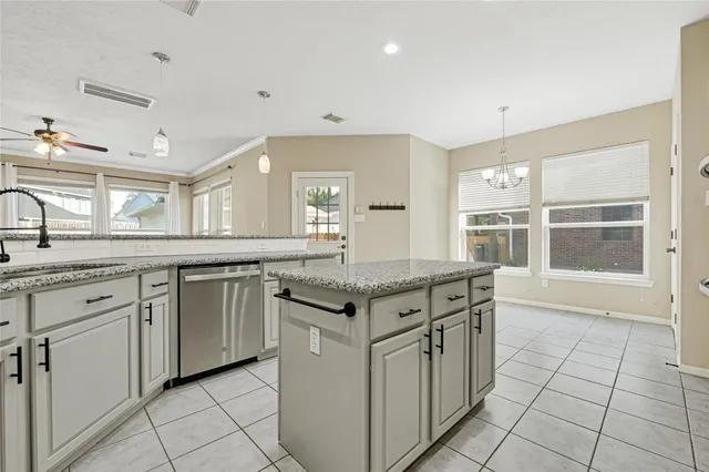 a kitchen with stainless steel appliances granite countertop a stove and a sink