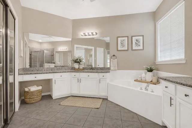 a bathroom with a sink a vanity and mirror