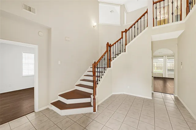 a view of entryway and hall with a workspace