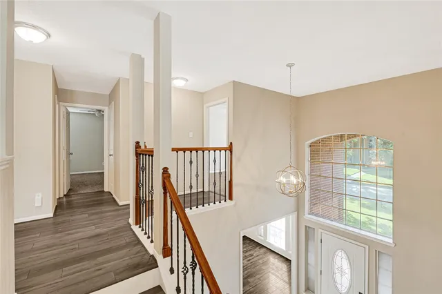 a view of an entryway with wooden floor
