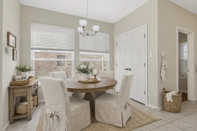 a view of a dining room with furniture and window