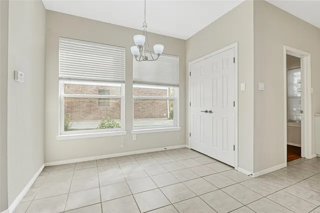 an empty room that has a window in it