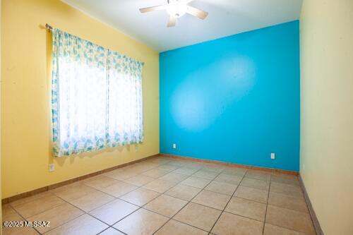 480 Camino Ramanote Rio Rico, AZ 85648 - Photo 21 of 43 Down the hall from the kitchen is the third bedroom with west facing window.
