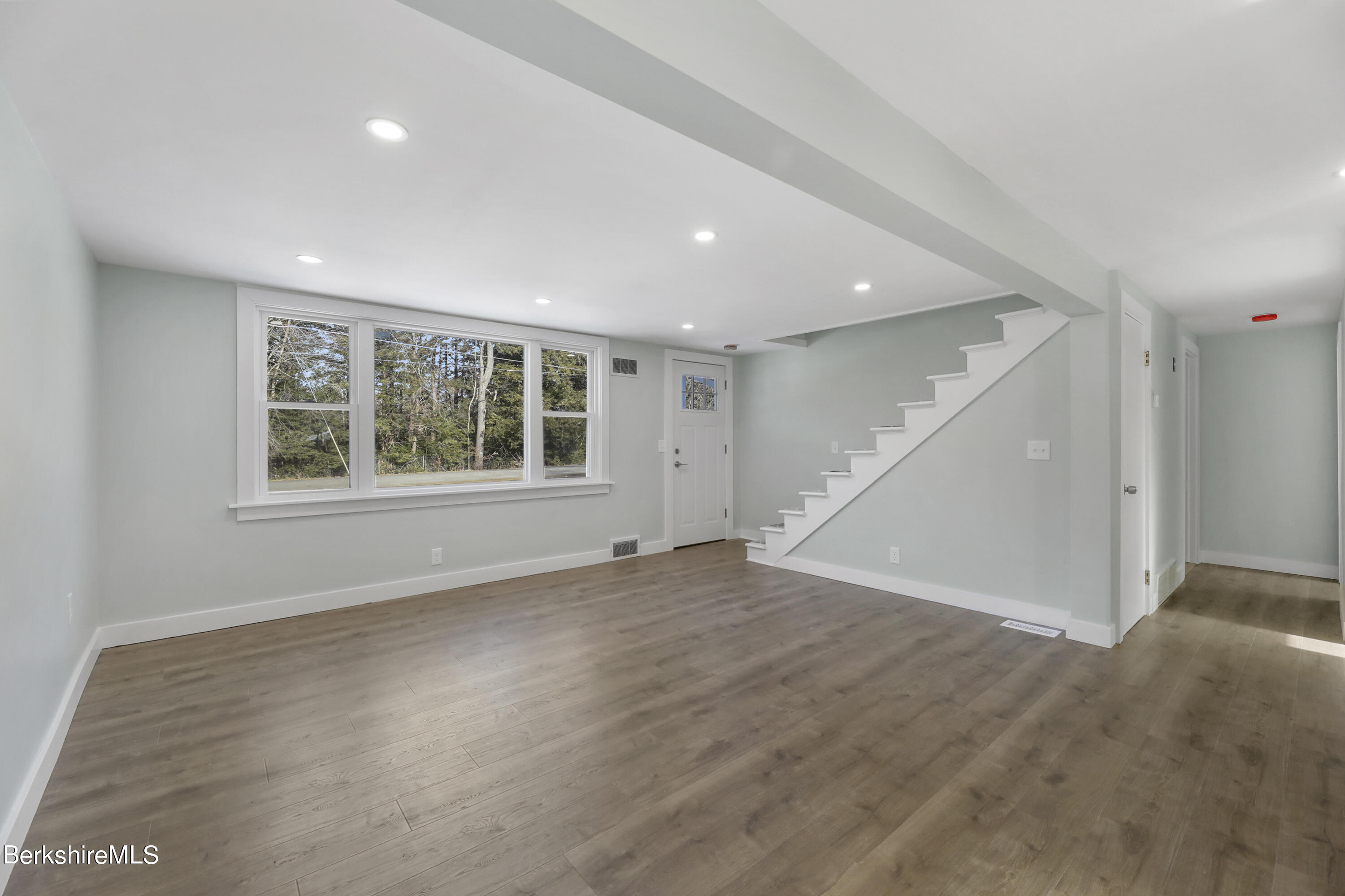 1130 Middle Road Clarksburg, MA 01247 - Photo 12 of 28 an empty room with wooden floor and windows