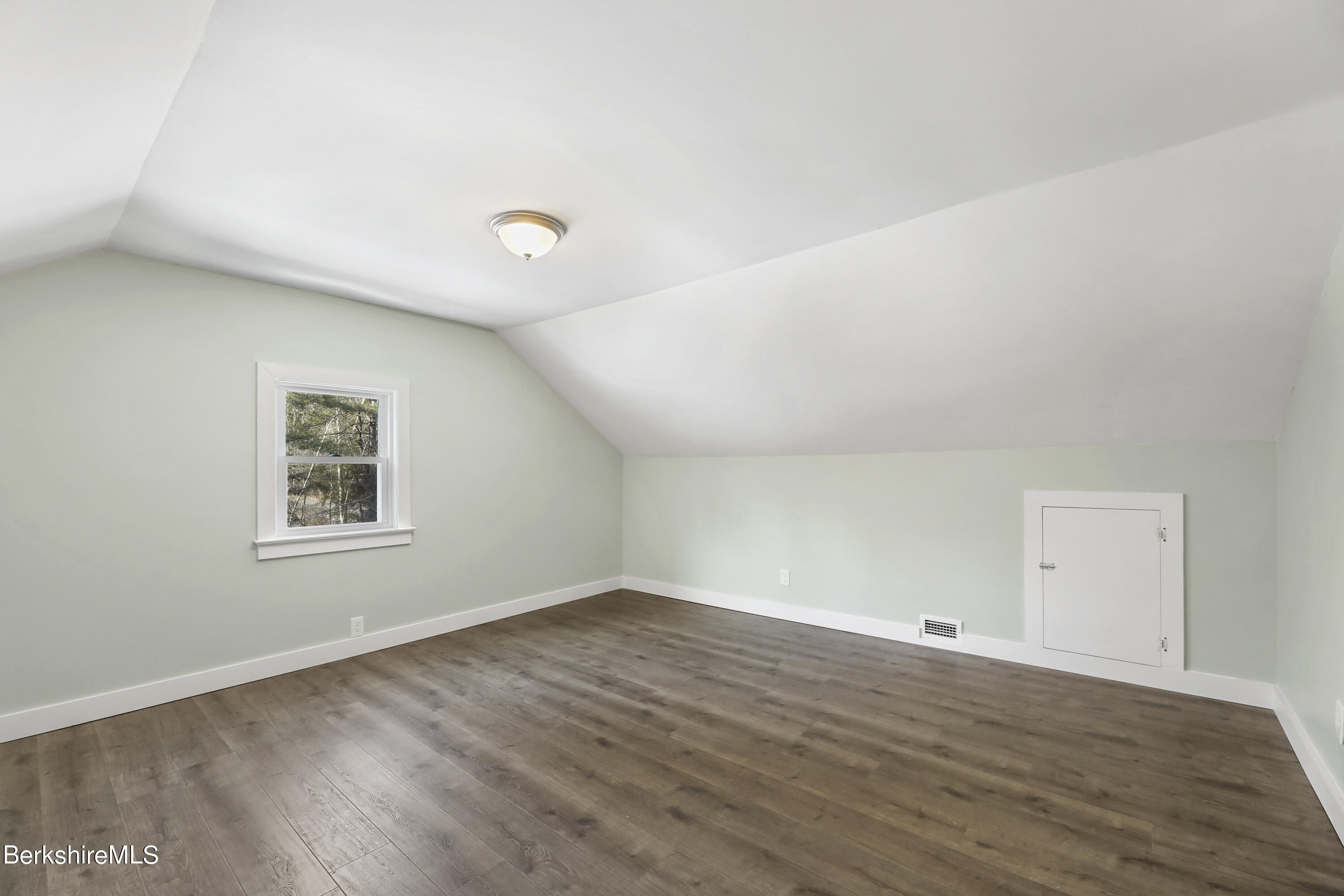 1130 Middle Road Clarksburg, MA 01247 - Photo 22 of 28 an empty room with wooden floor and window