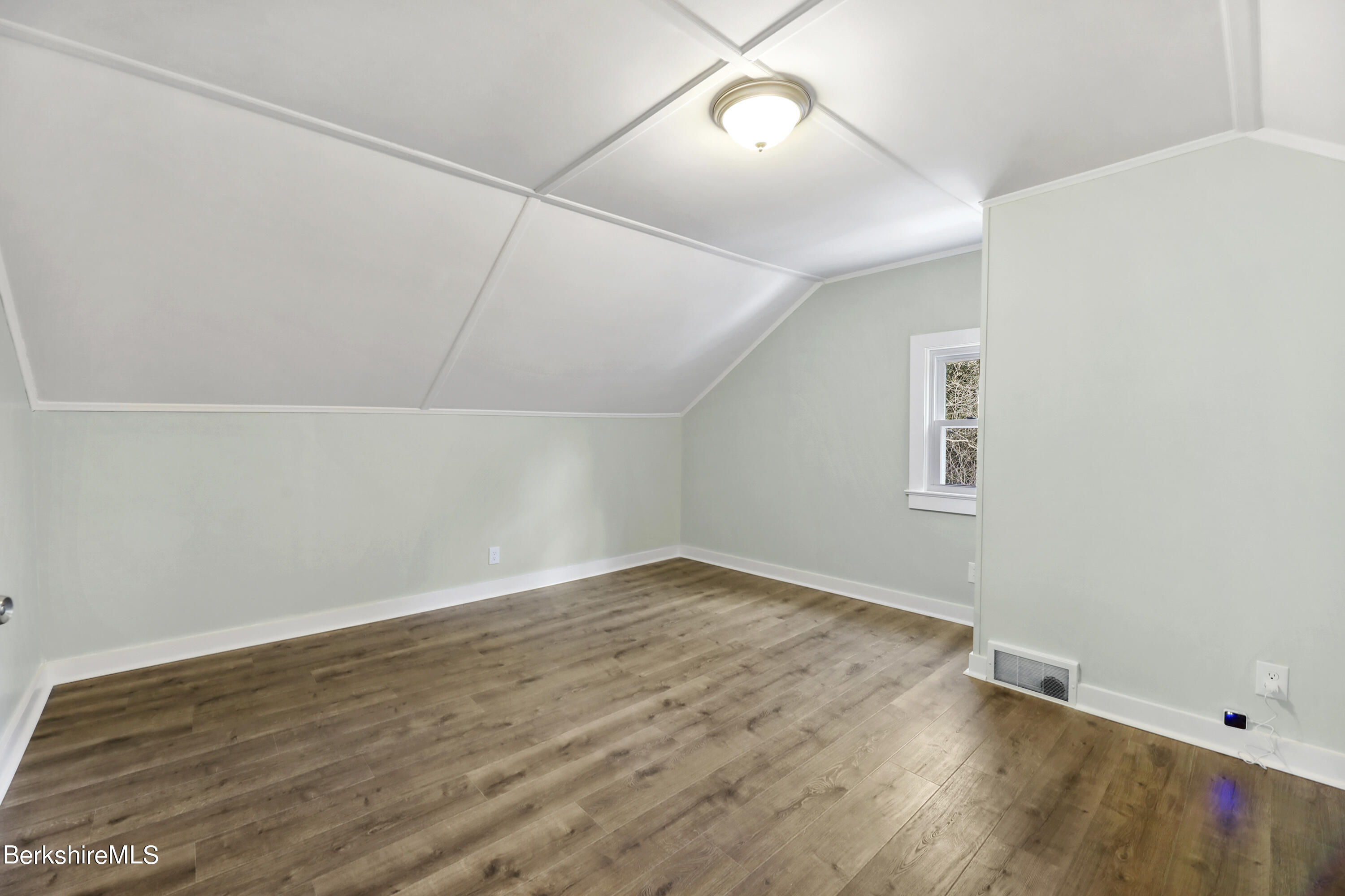 1130 Middle Road Clarksburg, MA 01247 - Photo 24 of 28 an empty room with wooden floor and windows