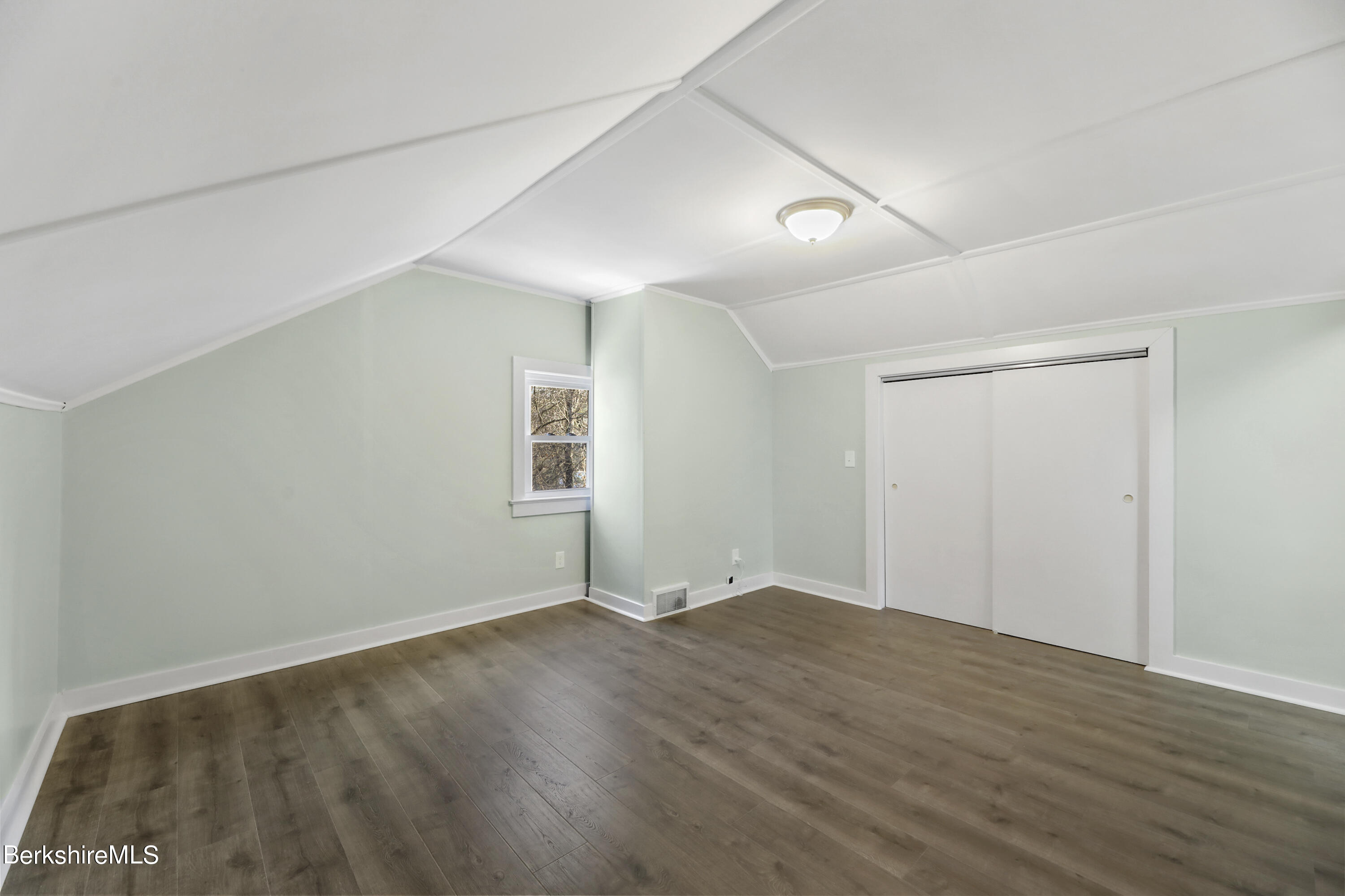 1130 Middle Road Clarksburg, MA 01247 - Photo 25 of 28 an empty room with wooden floor and windows