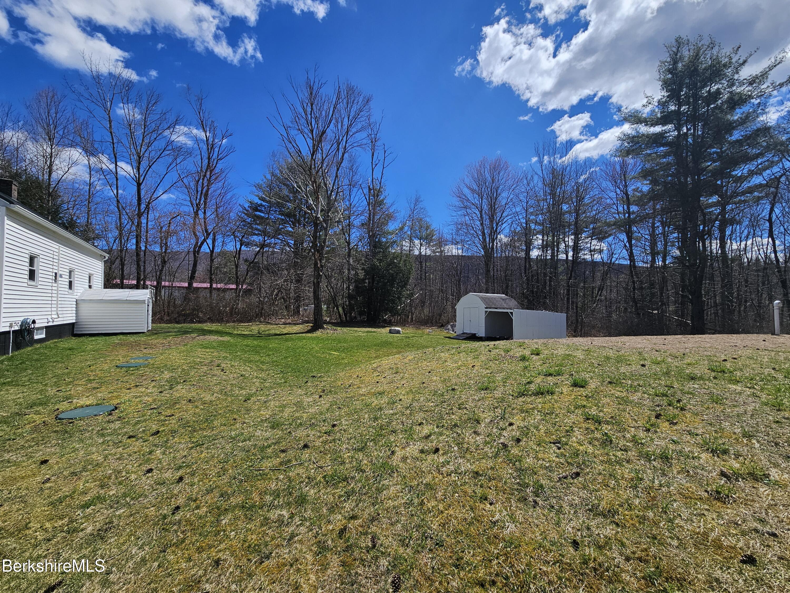 1130 Middle Road Clarksburg, MA 01247 - Photo 5 of 28 a backyard of a house with lots of green space