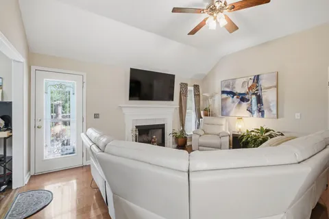 a living room with furniture and a fireplace
