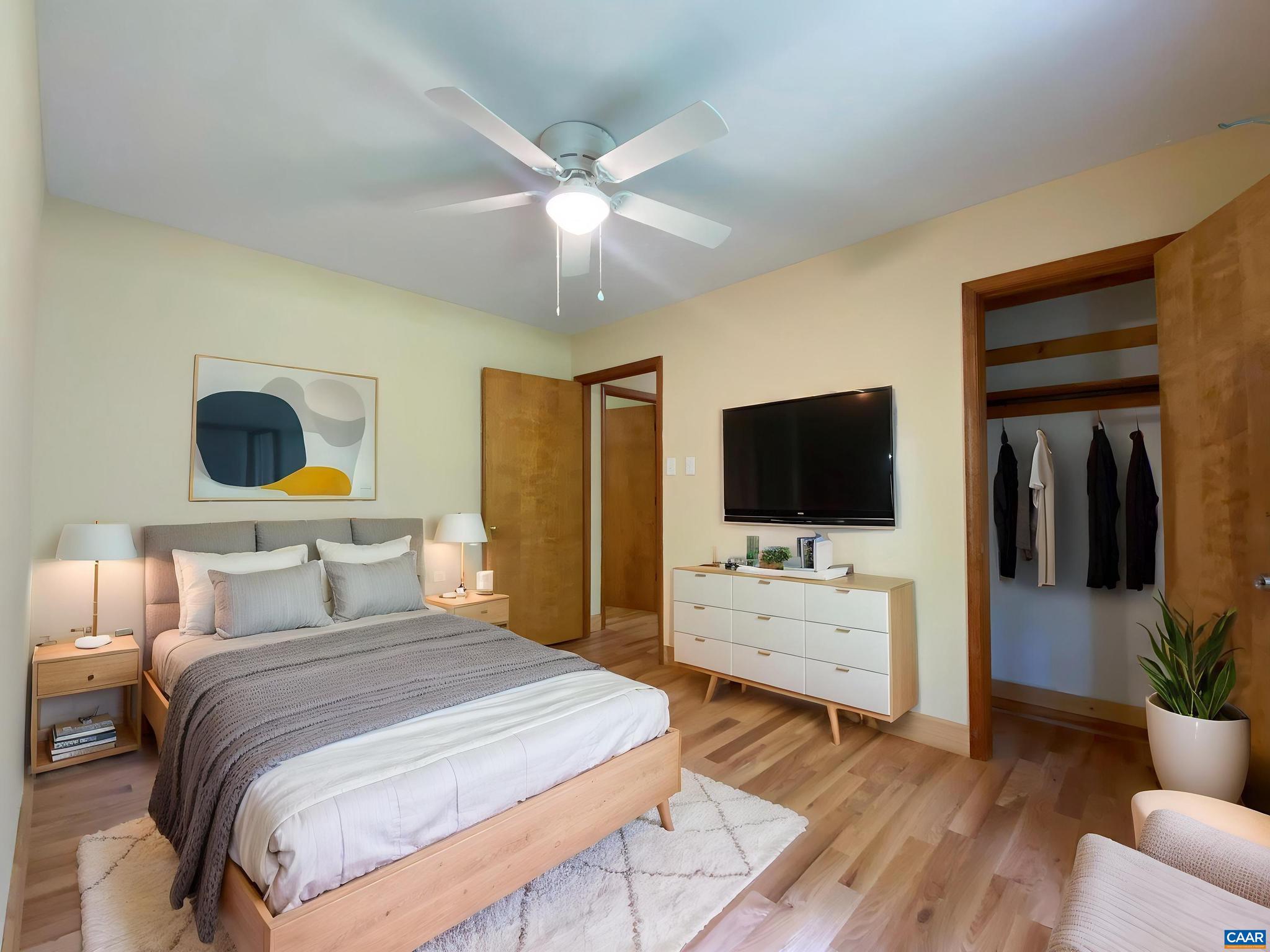 247 Goldenrod Road Ruckersville, VA 22968 - Photo 15 of 35 a bedroom with a bed and a flat screen tv