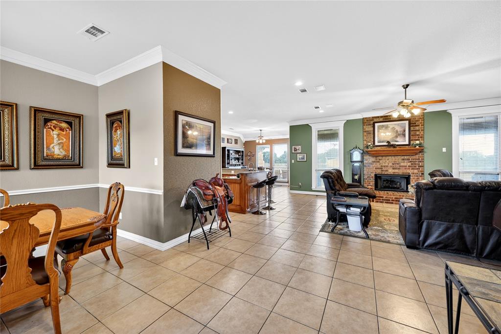 1035 Highland Road Cleburne, TX 76033 - Photo 10 of 36 a living room with furniture and a flat screen tv