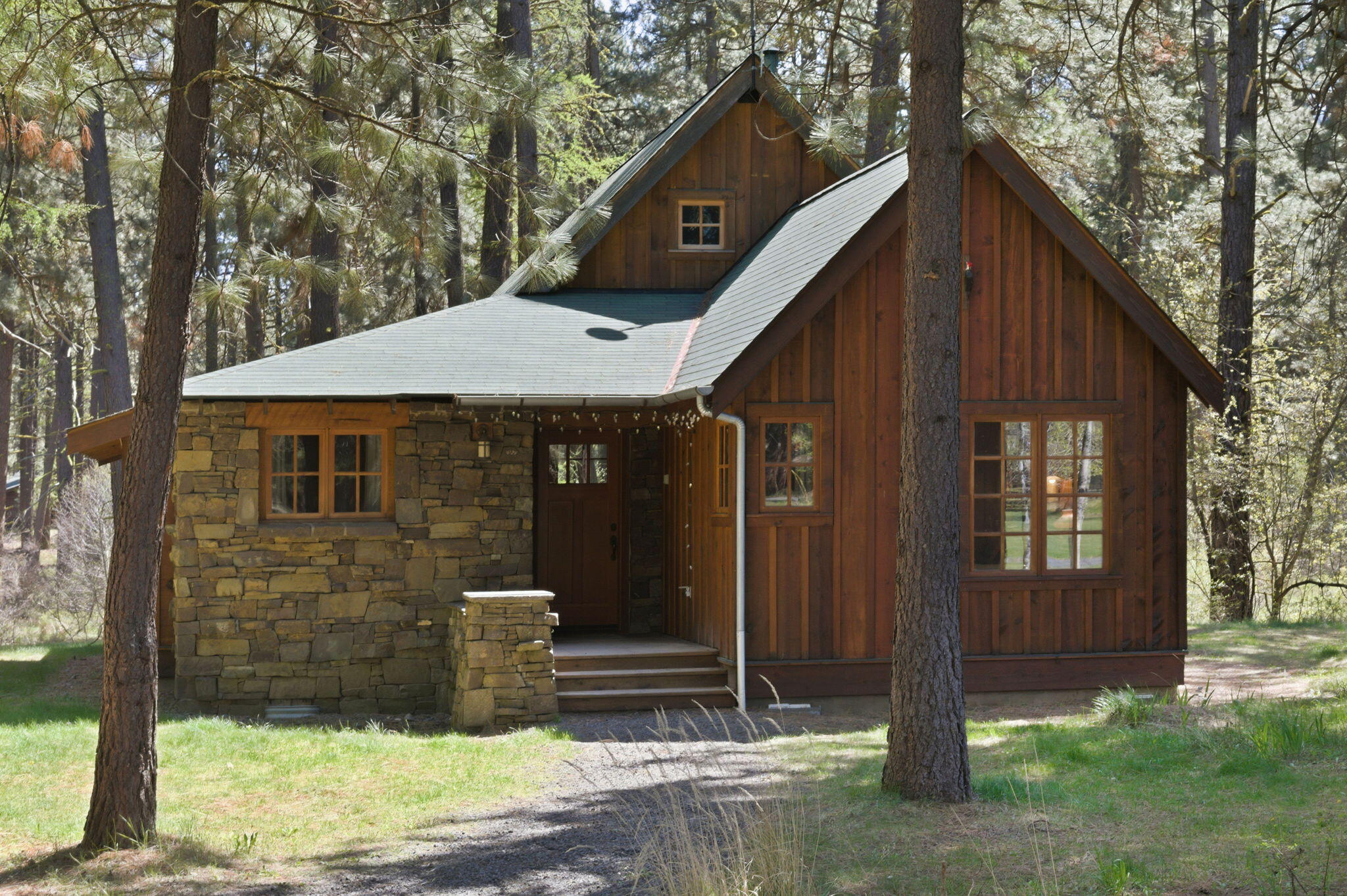 13375 Southwest Forest Service Road, Unit CABIN 18 U1 Camp Sherman, OR 97730 - Photo 1 of 31 a front view of a house with a yard