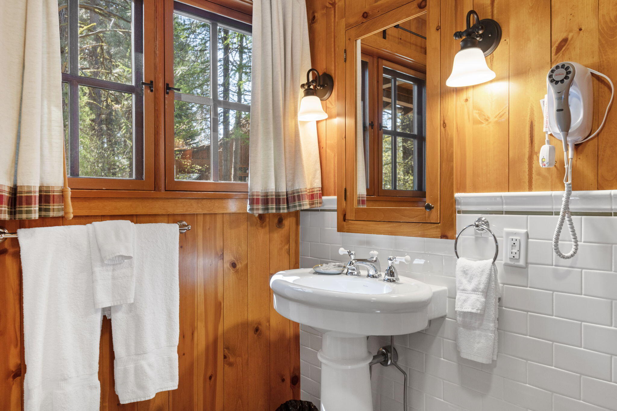 13375 Southwest Forest Service Road, Unit CABIN 18 U1 Camp Sherman, OR 97730 - Photo 16 of 31 a bathroom with a sink a mirror and a window