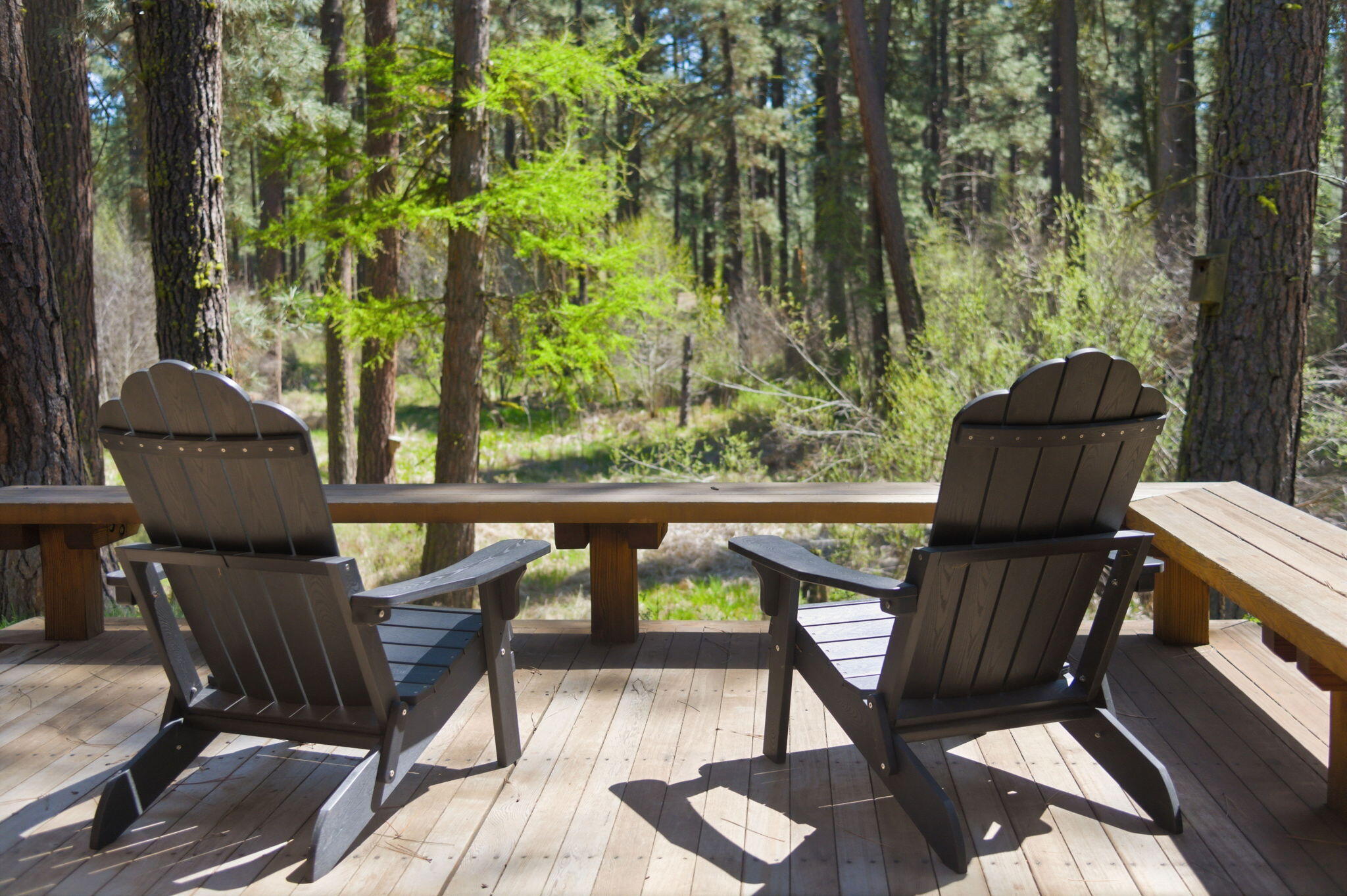13375 Southwest Forest Service Road, Unit CABIN 18 U1 Camp Sherman, OR 97730 - Photo 19 of 31 a view of balcony with wooden floor and outdoor seating