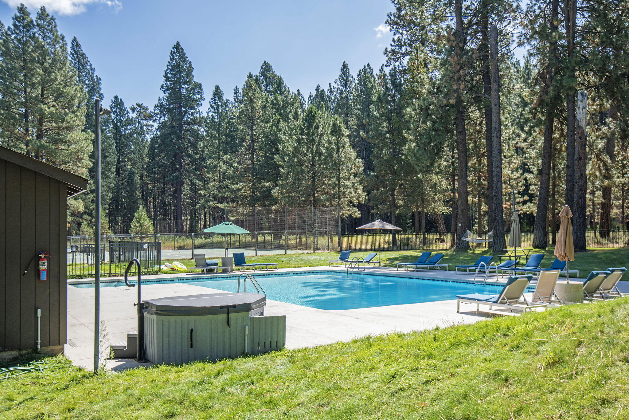 13375 Southwest Forest Service Road, Unit CABIN 18 U1 Camp Sherman, OR 97730 - Photo 26 of 31 a view of a swimming pool with a patio and a yard