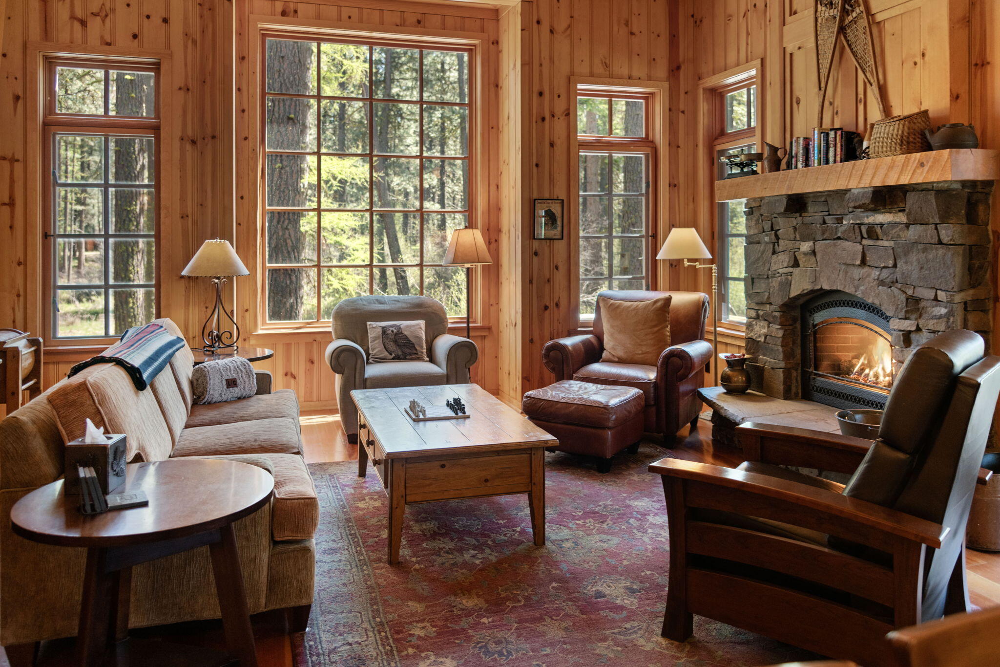 13375 Southwest Forest Service Road, Unit CABIN 18 U1 Camp Sherman, OR 97730 - Photo 3 of 31 a living room with furniture a large window and a fireplace