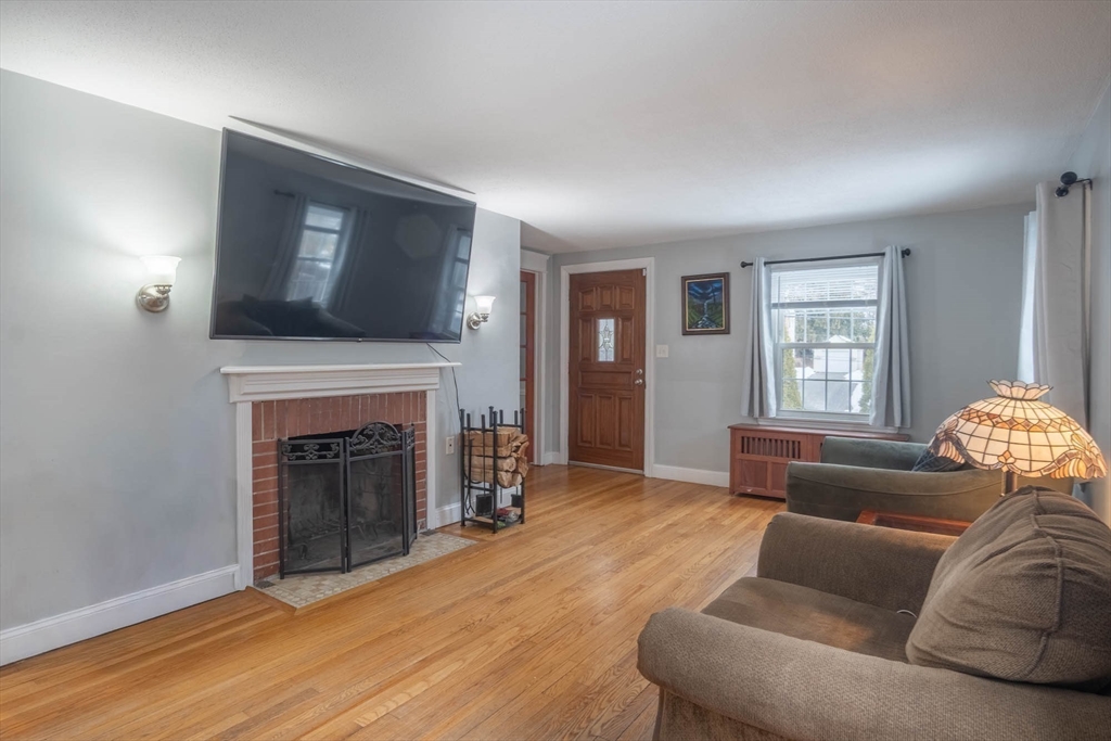 509 Plumtree Road Springfield, MA 01118 - Photo 4 of 34 a living room with furniture and a fireplace