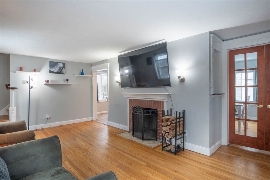 509 Plumtree Road Springfield, MA 01118 - Photo 6 of 34 a living room with furniture and a fireplace