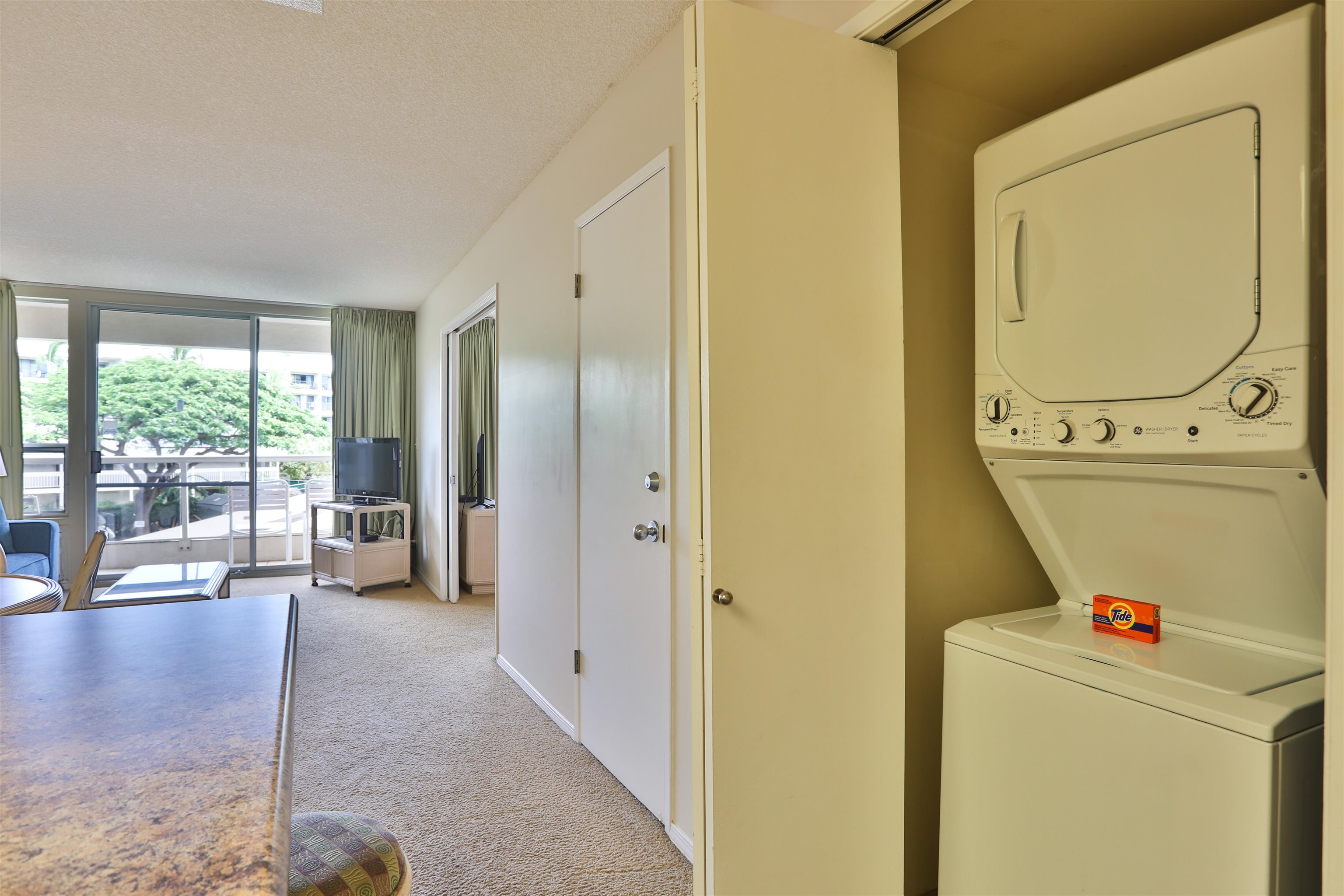 2575 South Kihei Road, Unit G306 Kihei, HI 96753 - Photo 18 of 18 a view of washer and dryer with bathroom in the background
