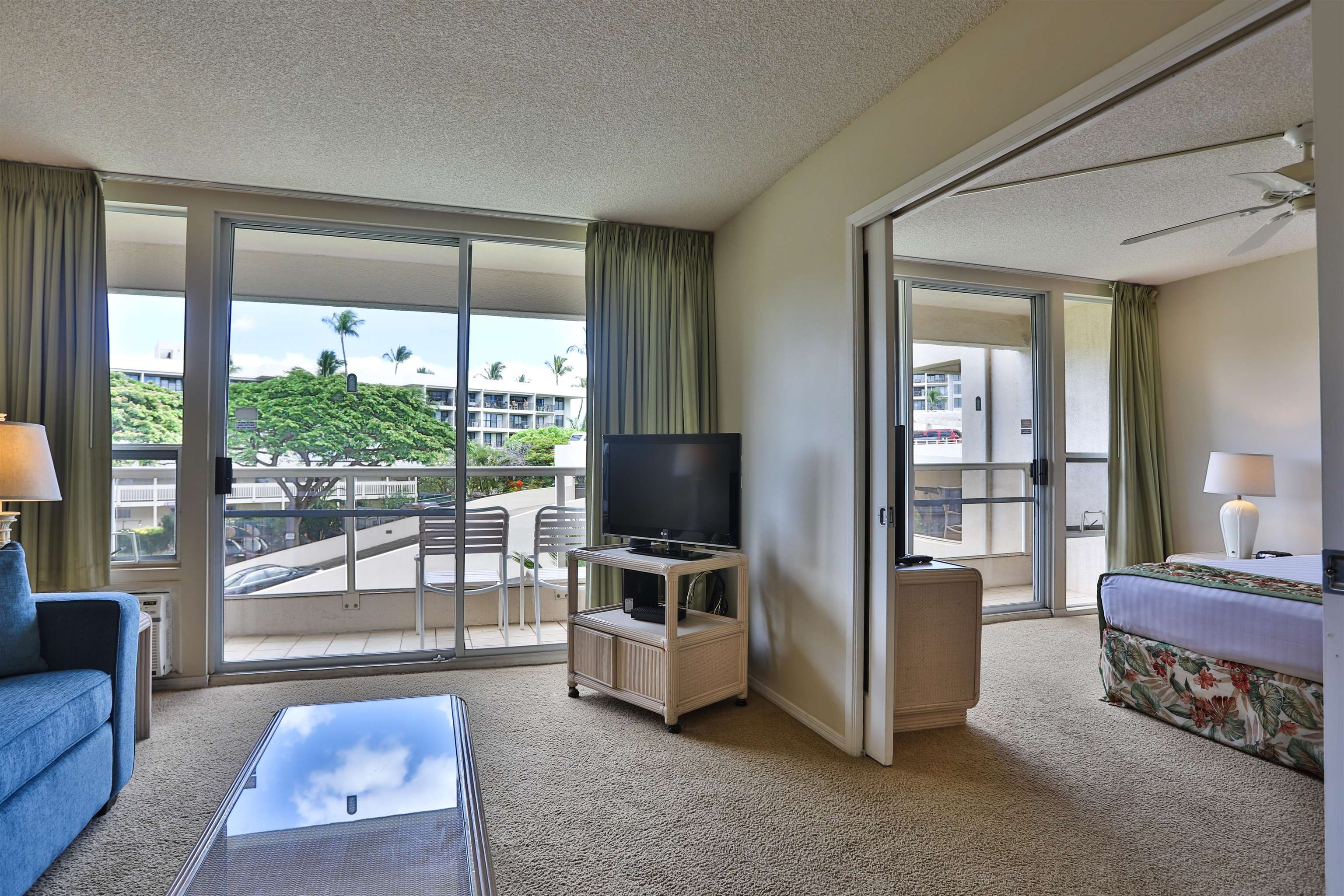 2575 South Kihei Road, Unit G306 Kihei, HI 96753 - Photo 5 of 18 a living room with furniture and a flat screen tv