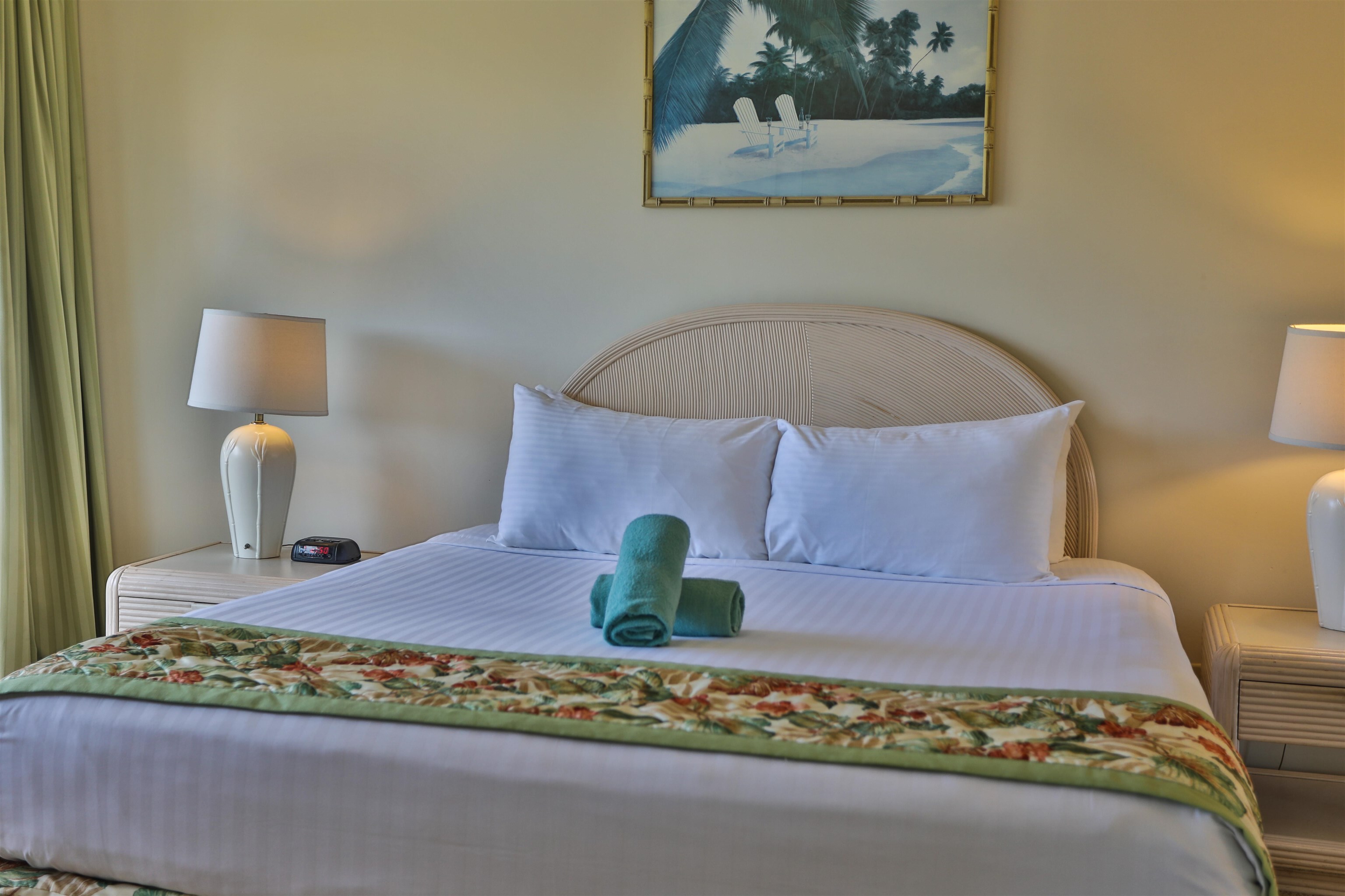 2575 South Kihei Road, Unit G306 Kihei, HI 96753 - Photo 7 of 18 a bedroom with a bed and wooden floor