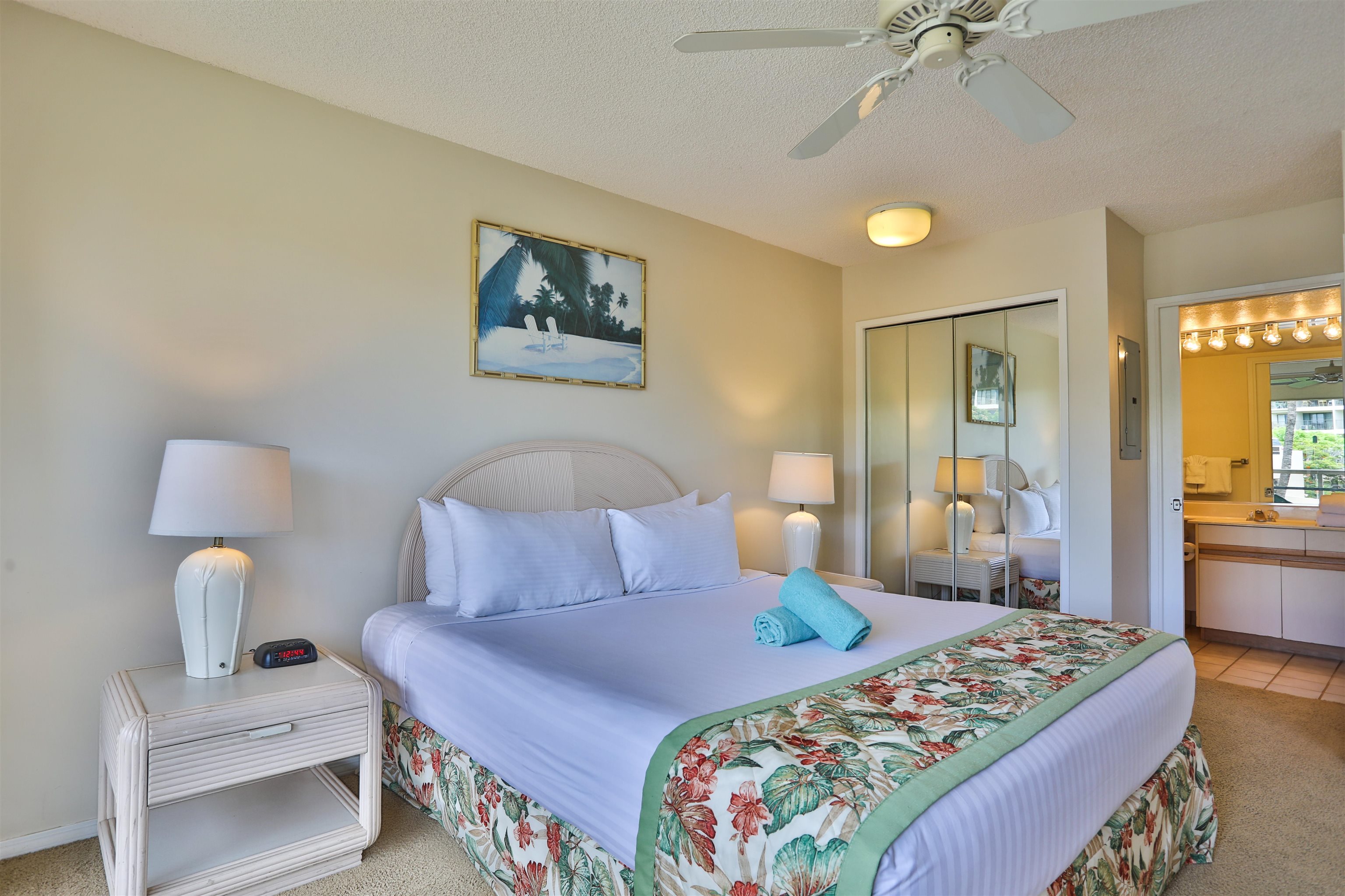 2575 South Kihei Road, Unit G306 Kihei, HI 96753 - Photo 8 of 18 a bedroom with bed and a night stand