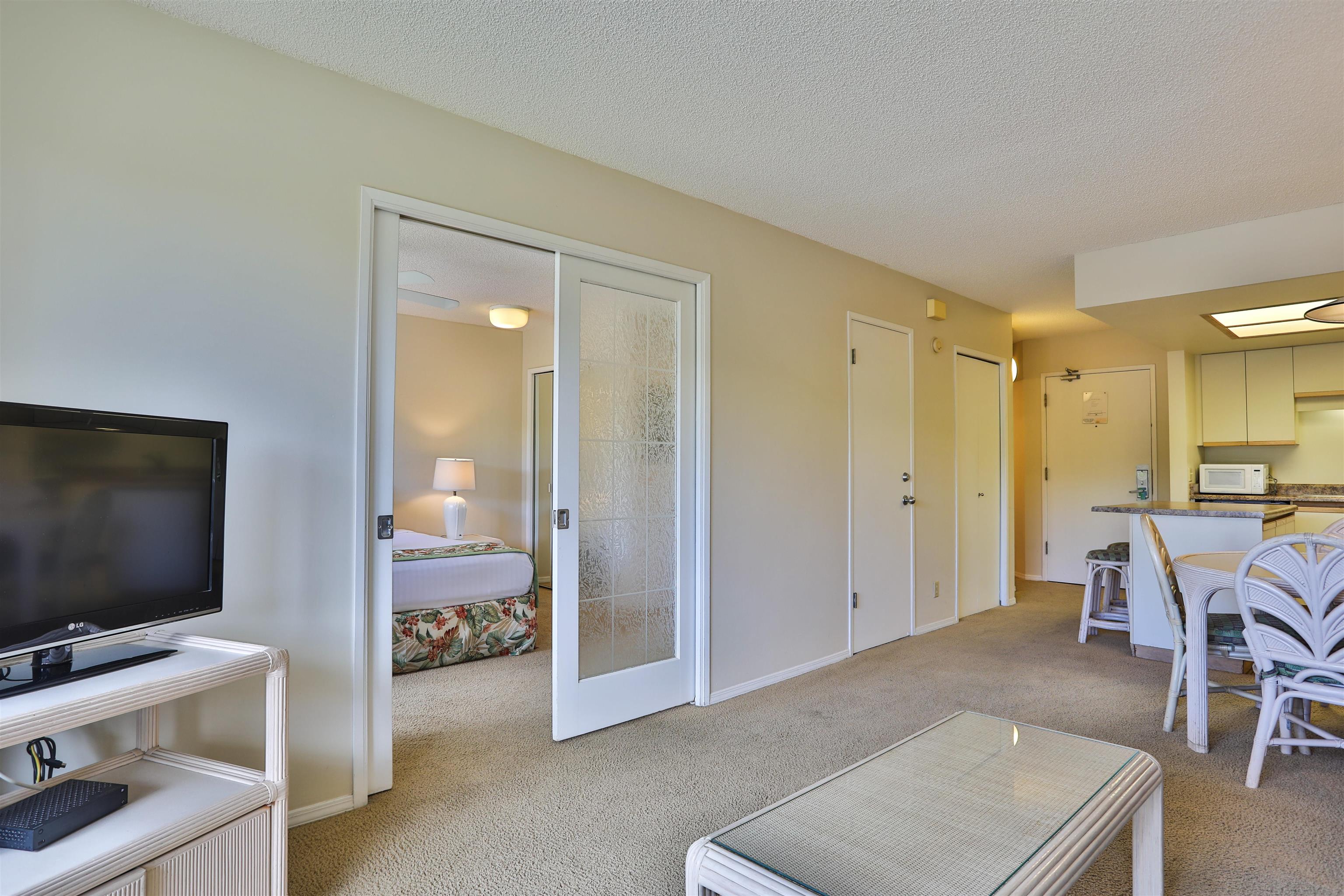 2575 South Kihei Road, Unit G306 Kihei, HI 96753 - Photo 10 of 18 a living room with furniture and a flat screen tv