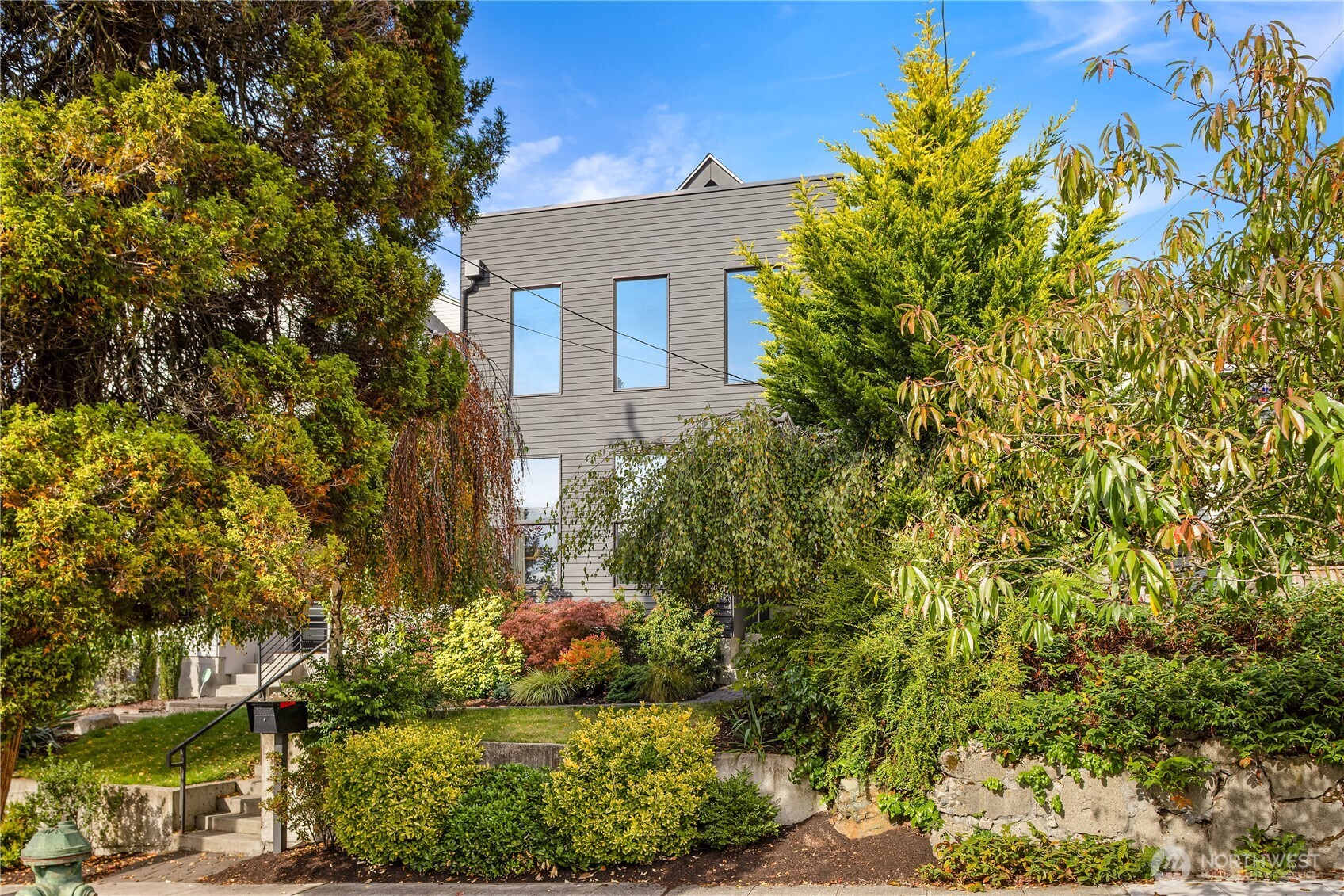 1826 South Lane Street Seattle, WA 98144 - Photo 1 of 1 a view of a house with a yard and garden