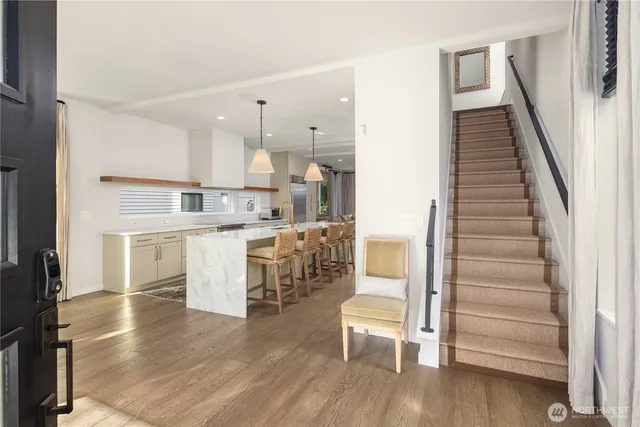 a view of kitchen with cabinets and wooden floor