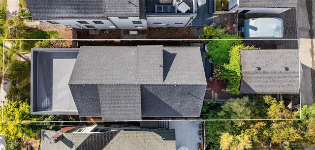 an aerial view of a house with a swimming pool