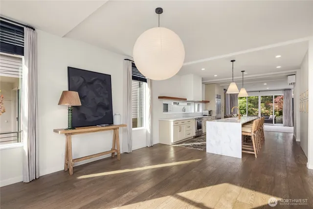 a view of kitchen with furniture and wooden floor