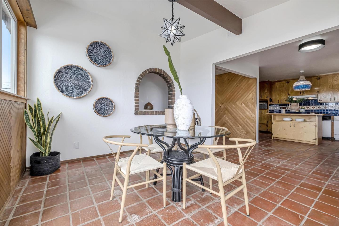 722 Seacliff Drive Aptos, CA 95003 - Photo 17 of 51 a view of a dining room and kitchen with a chandelier