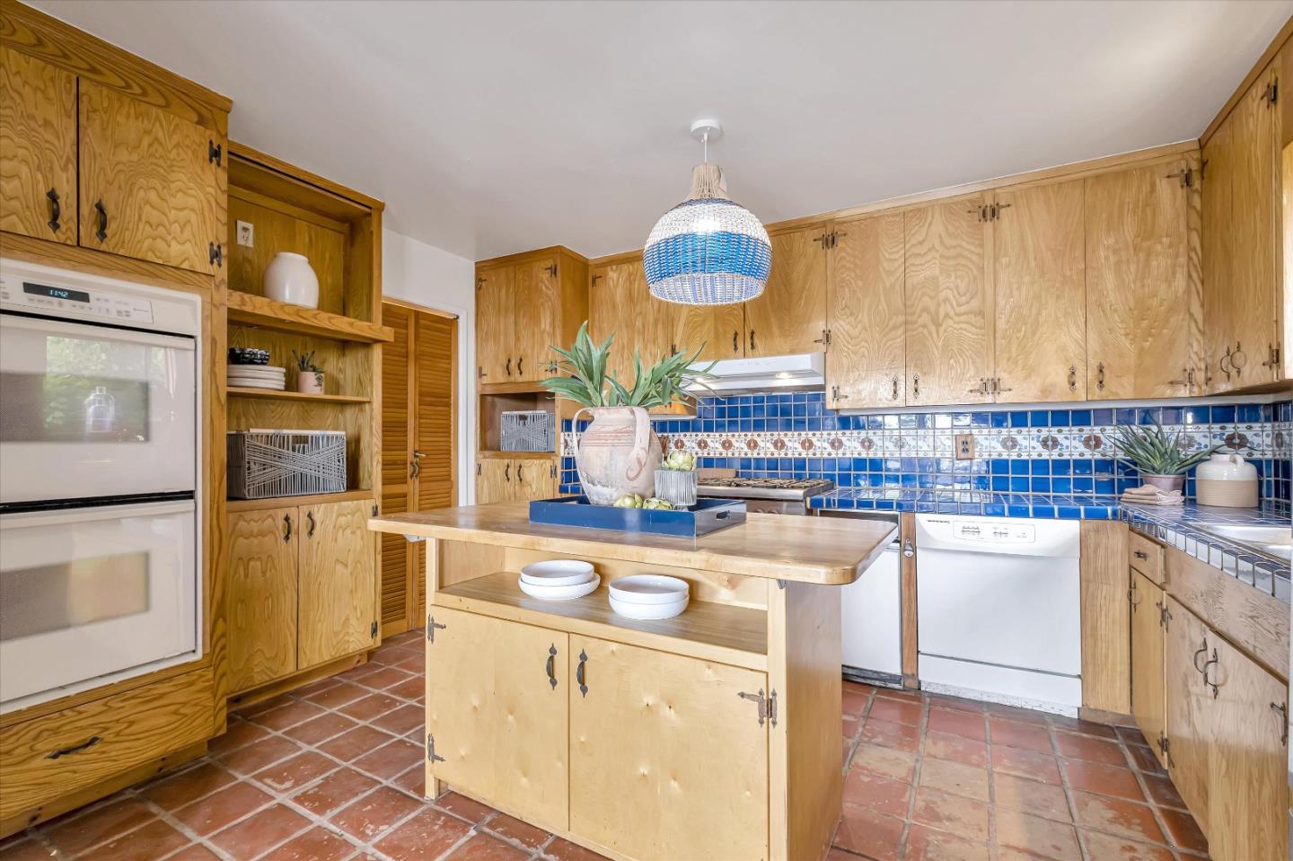 722 Seacliff Drive Aptos, CA 95003 - Photo 20 of 51 a kitchen that has a lot of cabinets in it and wooden floors