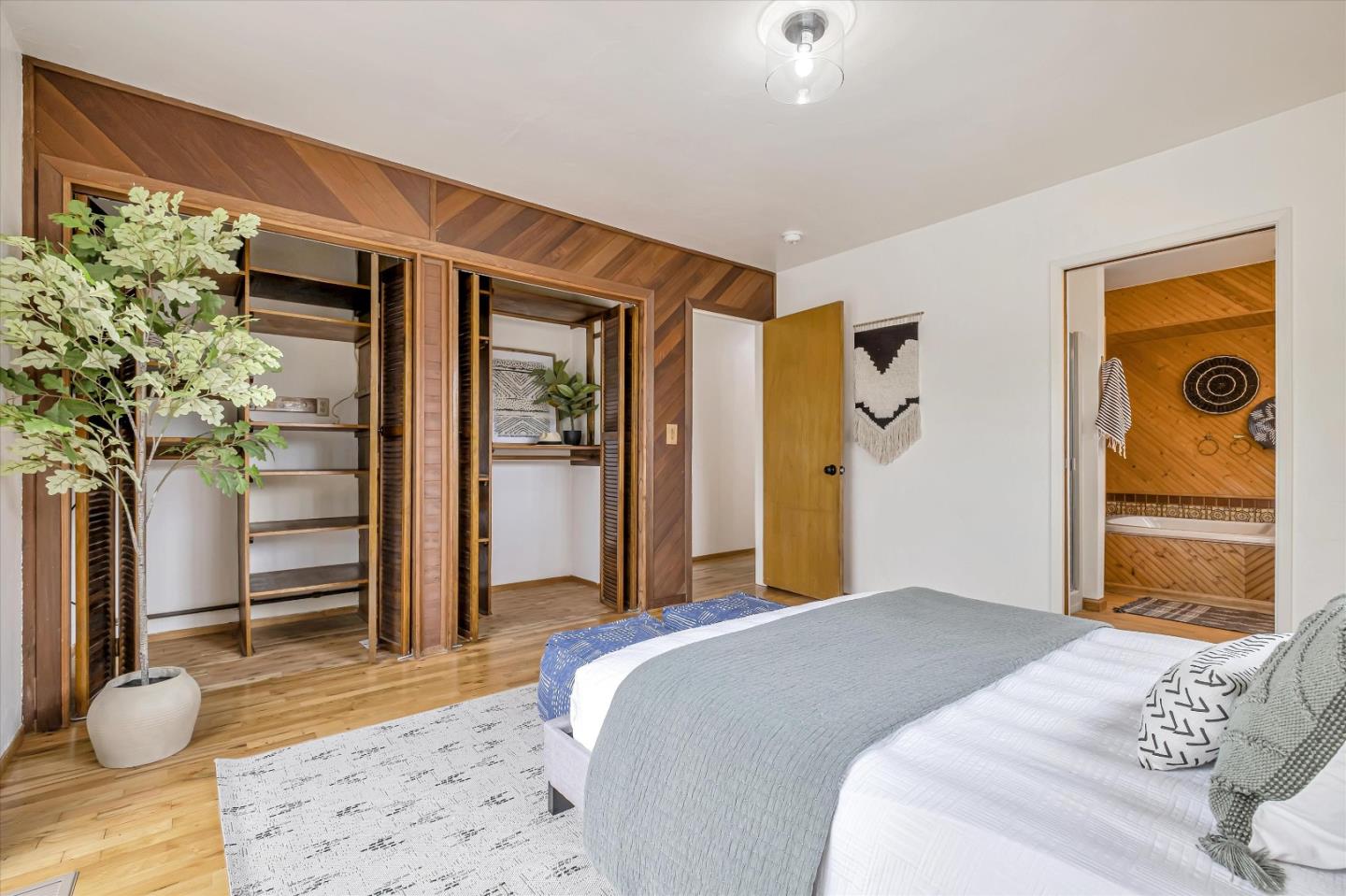 722 Seacliff Drive Aptos, CA 95003 - Photo 25 of 51 a bedroom with a bed and a potted plant