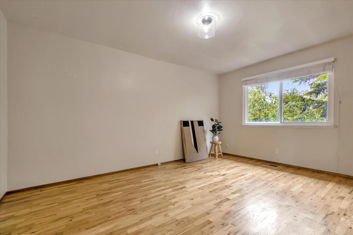 722 Seacliff Drive Aptos, CA 95003 - Photo 30 of 51 a view of an empty room with wooden floor and a window